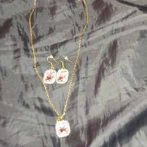 Cubic zirconia/rhinestone and pink faux gem gold plated necklace and earrings.